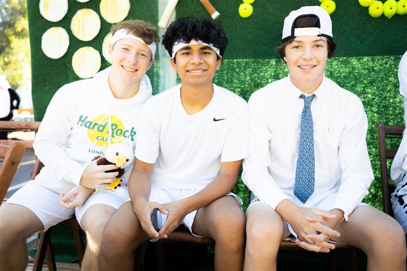 Students ride on a homecoming parade float